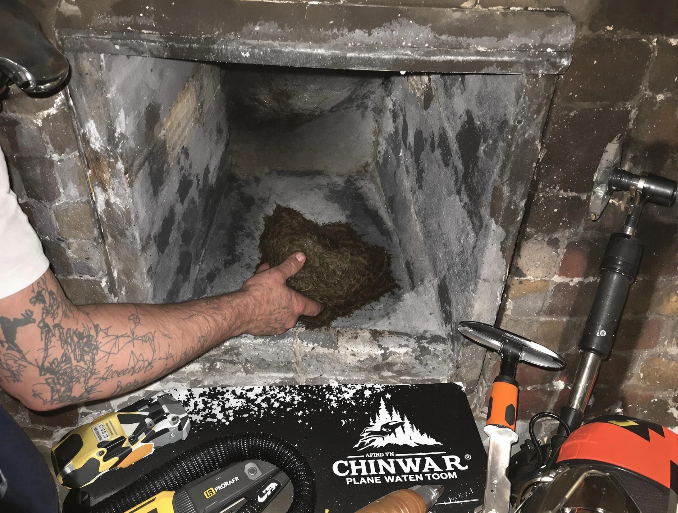 East Brunswick Chimney Sweep safely removing debris and screening chimney in East Brunswick, NJ